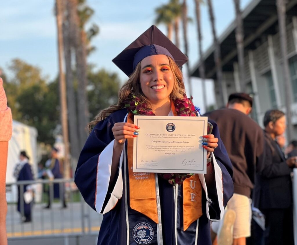 Photo of a smiling college graduate